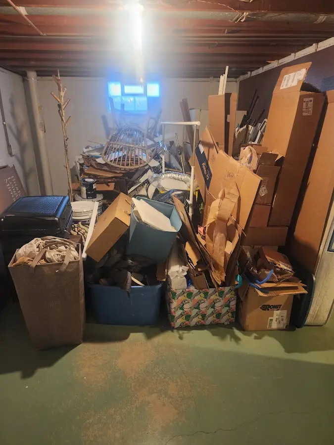 Roll-off dumpster container at job site for 4 Yard Dumpster Rental in Clute